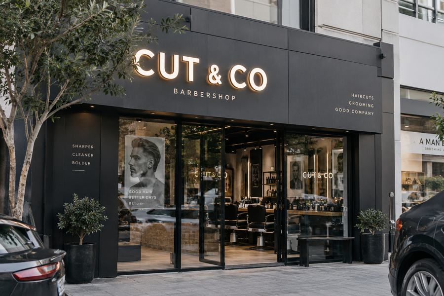 Barbershop signage in Dubai: Face-lit 3D letters with window and wall graphics
